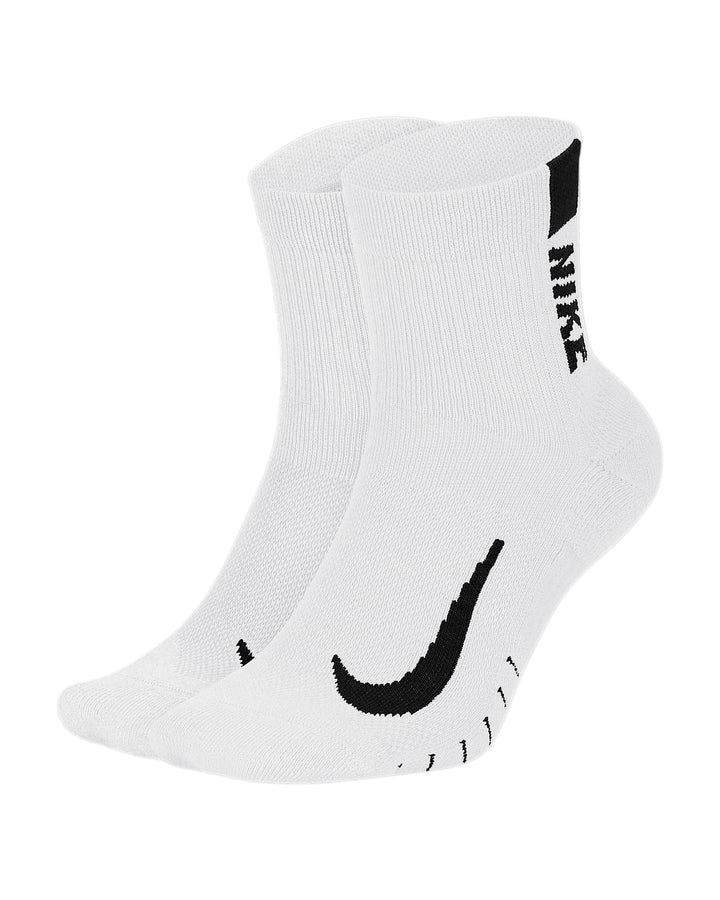 White nike athletic socks with black swoosh and text design.