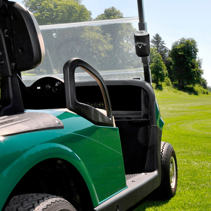 Green and black golf cart with clear windshield cover, callaway logo on the side.