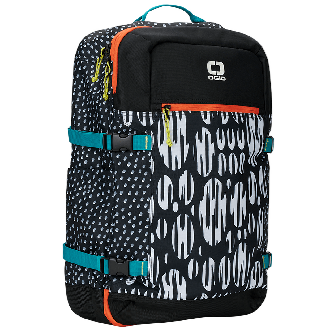 Black and white patterned backpack with teal accents, orange zipper pull, and ’ogio’ logo.