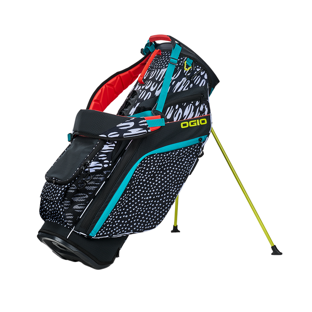 Black and teal golf bag with yellow accents, featuring a unique pattern of white text on the front.