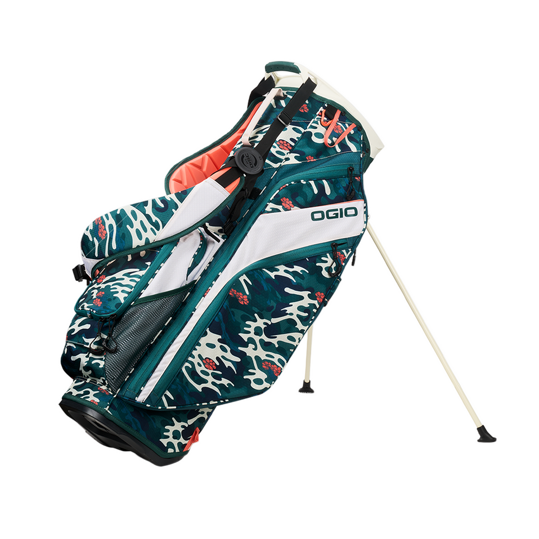 Green and white skull-patterned golf bag with black accents, featuring the ogio brand logo.